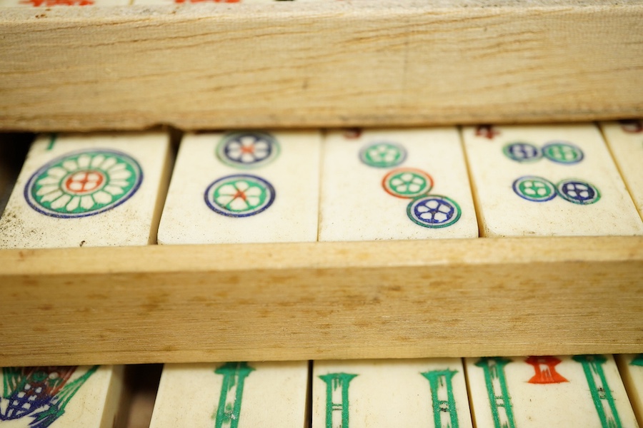 A Chinese bone mahjong set, cased, 23cm wide. Condition - fair